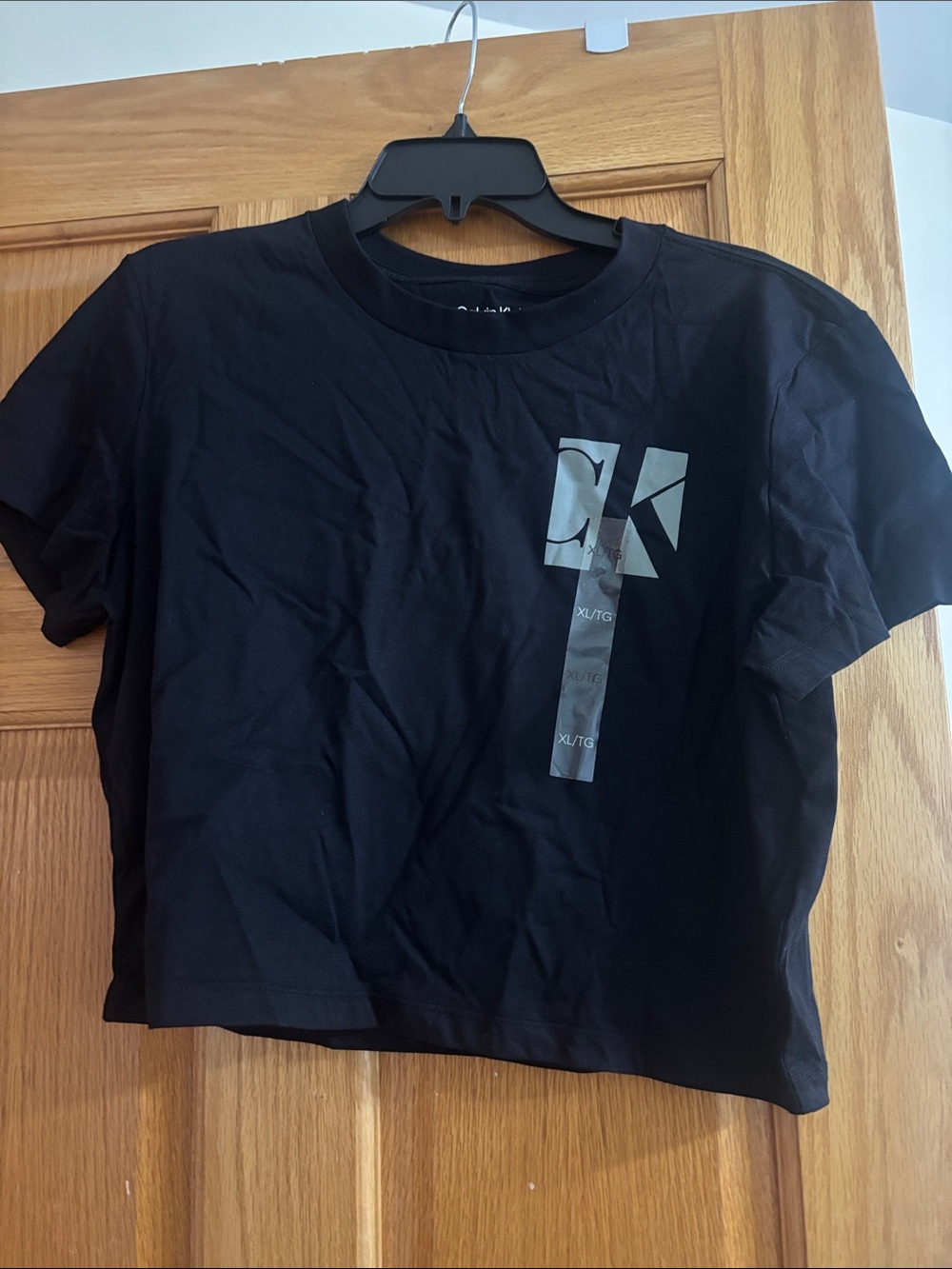 Calvin Klein Black Short Sleeve Crop Tee with Silver CK Graphic